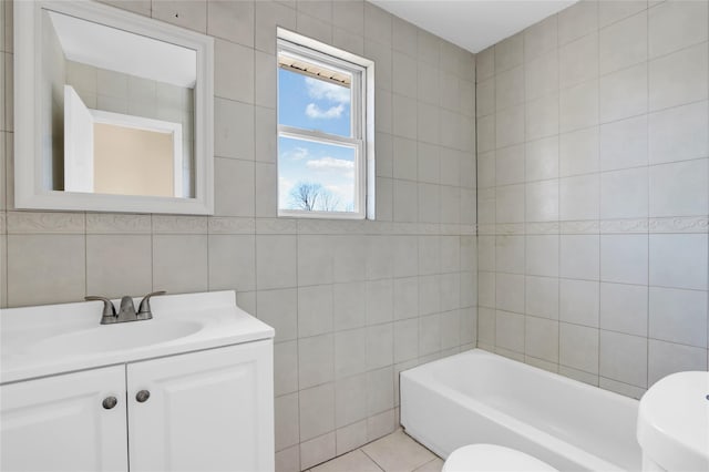 83 Fairview Ave, Islip Terrace, NY 11752 - full bathroom featuring vanity, a washtub, toilet, tile walls, and tile patterned floors
