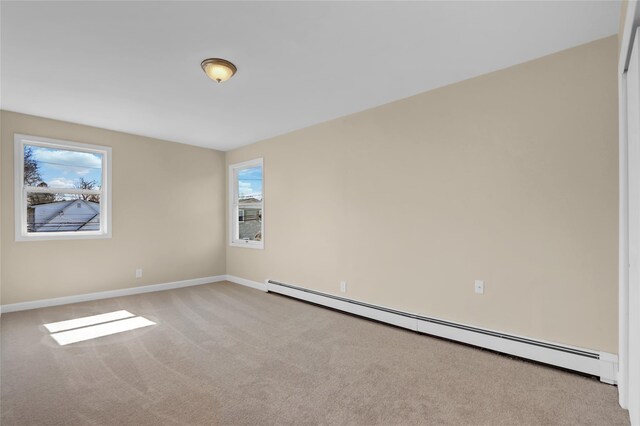 83 Fairview Ave, Islip Terrace, NY 11752 - unfurnished room with baseboard heating, baseboards, and carpet floors