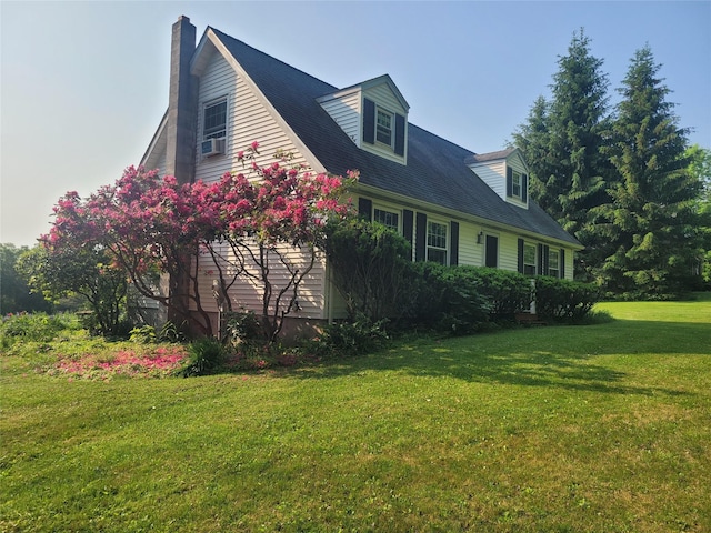 20 Bowers Dr, Hurleyville, NY 12747 - view of side of property with a yard, a chimney, a garage, and cooling unit