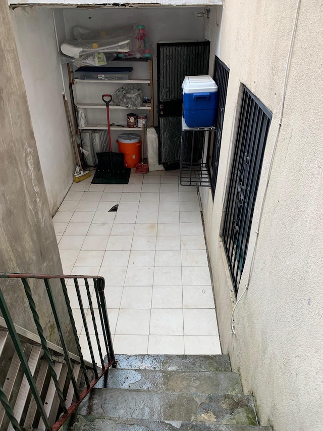 104-27 38th Ave Unit 1B, Corona, NY 11368 - staircase with tile patterned floors