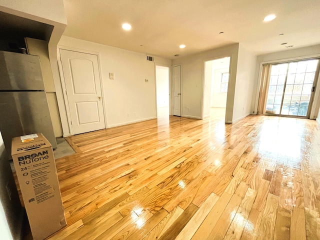 104-27 38th Ave Unit 1B, Corona, NY 11368 - unfurnished living room featuring light wood-style floors, baseboards, visible vents, and recessed lighting