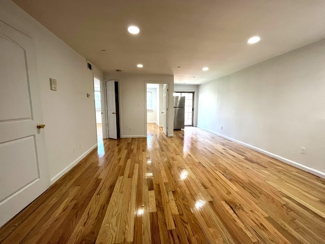 104-27 38th Ave Unit 1B, Corona, NY 11368 - empty room with light wood-style floors, baseboards, visible vents, and recessed lighting