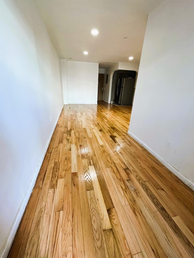 104-27 38th Ave Unit 1B, Corona, NY 11368 - interior space with arched walkways, light wood finished floors, baseboards, and recessed lighting