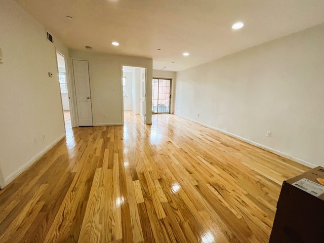 104-27 38th Ave Unit 1B, Corona, NY 11368 - unfurnished living room with recessed lighting, light wood finished floors, visible vents, and baseboards