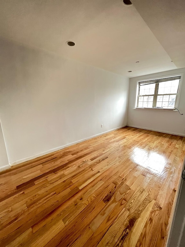 104-27 38th Ave Unit 1B, Corona, NY 11368 - empty room featuring light wood-style floors and baseboards