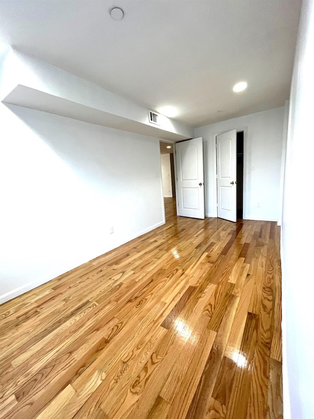 104-27 38th Ave Unit 1B, Corona, NY 11368 - spare room featuring recessed lighting, visible vents, and wood finished floors