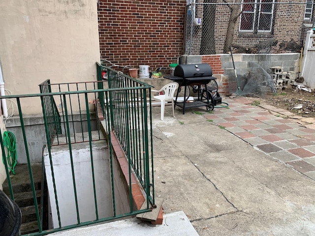 104-27 38th Ave Unit 1B, Corona, NY 11368 - view of patio / terrace with a grill and fence