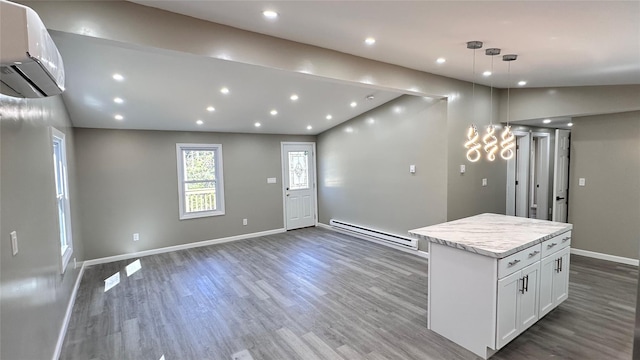734 Cooley Rd, Parksville, NY 12768 - entrance foyer with baseboard heating, an AC wall unit, wood finished floors, lofted ceiling, and recessed lighting