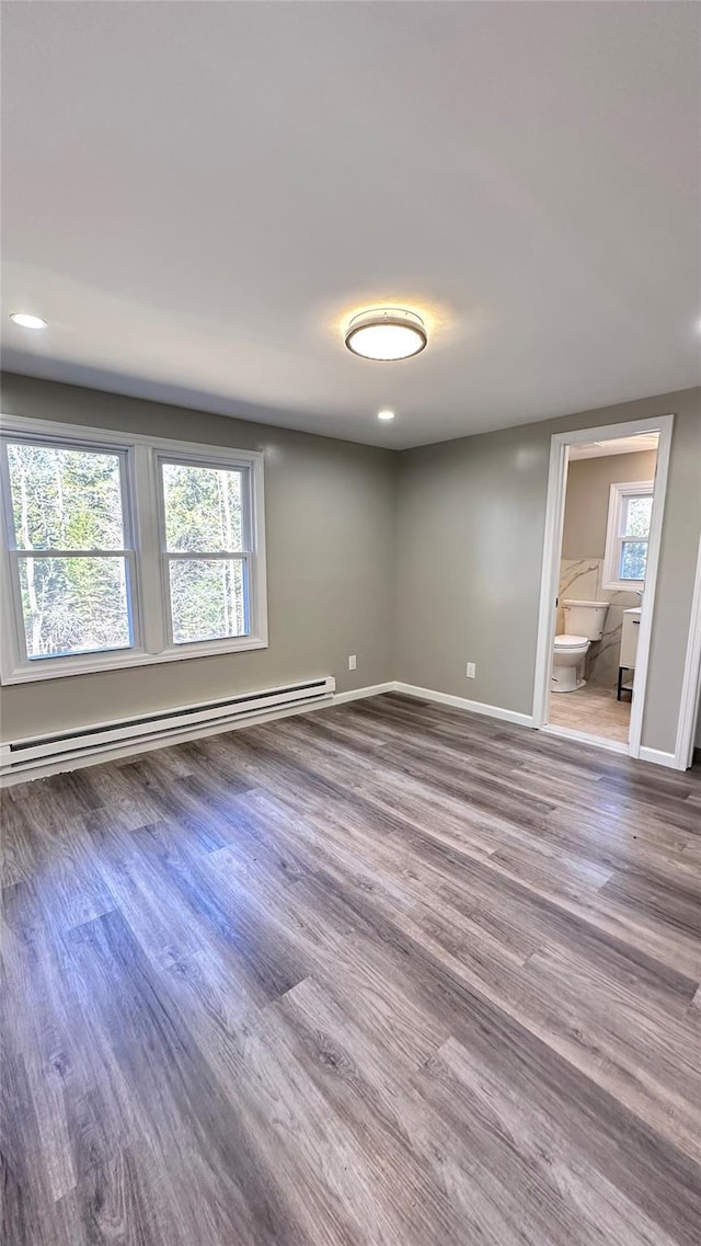 734 Cooley Rd, Parksville, NY 12768 - spare room with a baseboard radiator, wood finished floors, and recessed lighting