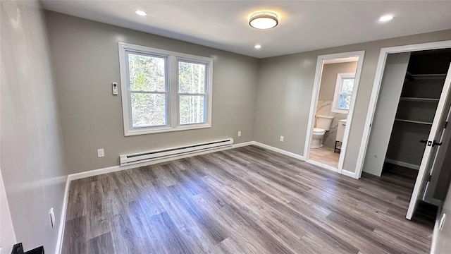 734 Cooley Rd, Parksville, NY 12768 - unfurnished bedroom with a baseboard radiator, wood finished floors, ensuite bath, recessed lighting, and a closet