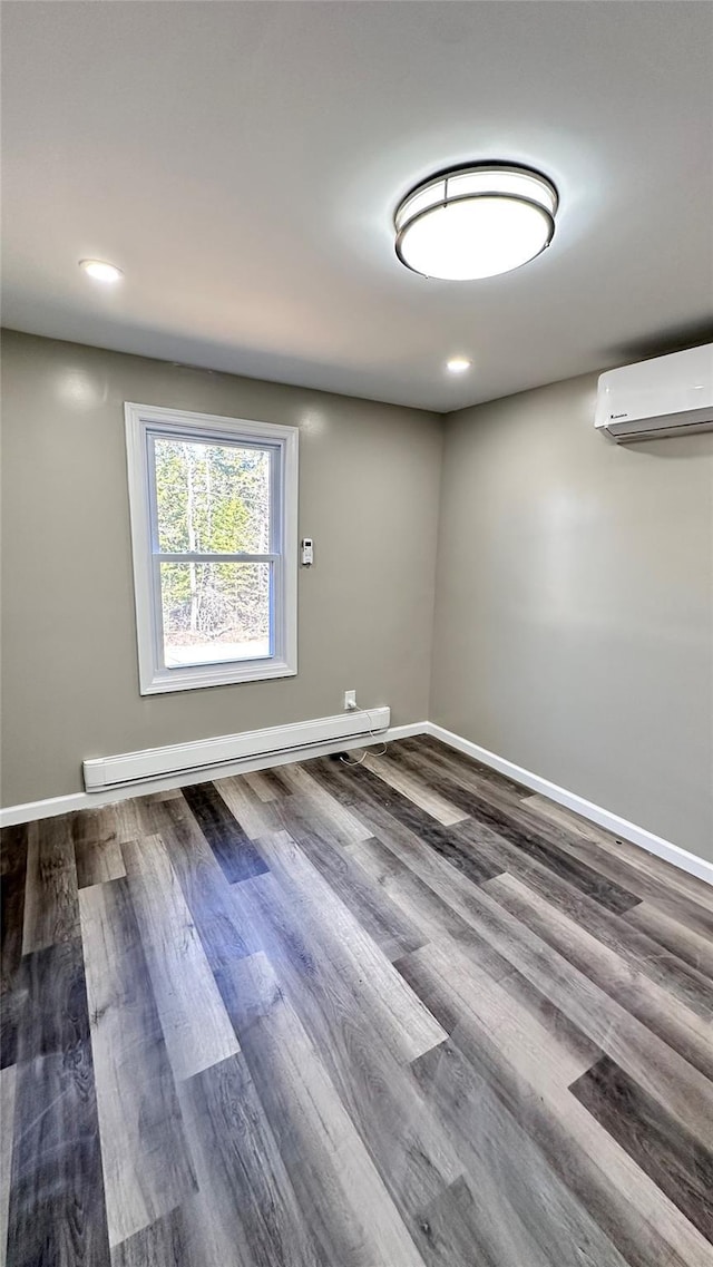 734 Cooley Rd, Parksville, NY 12768 - unfurnished room featuring a wall mounted AC, a baseboard heating unit, wood finished floors, and recessed lighting