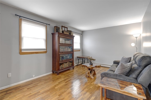 sitting room with light wood-style flooring and baseboards