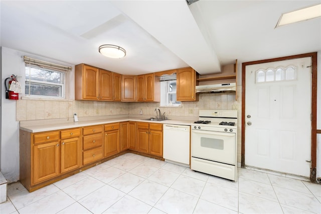 1290 Edison Ave, Bronx, NY 10461 - kitchen with a sink, light countertops, white appliances, and under cabinet range hood