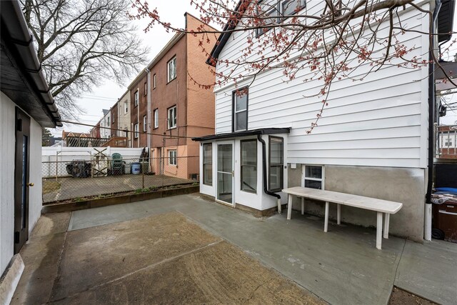 1290 Edison Ave, Bronx, NY 10461 - back of house featuring a patio and fence