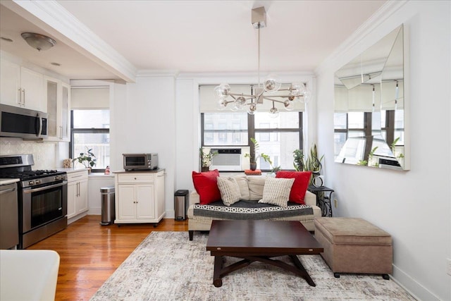 710 Riverside Dr Unit 6B, New York Manhattan, NY 10031 - interior space featuring cooling unit, stainless steel appliances, an inviting chandelier, and ornamental molding
