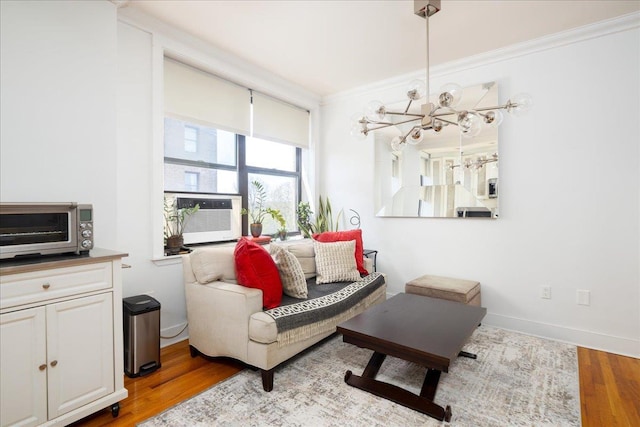710 Riverside Dr Unit 6B, New York Manhattan, NY 10031 - interior space featuring a notable chandelier, light wood-type flooring, cooling unit, crown molding, and a toaster