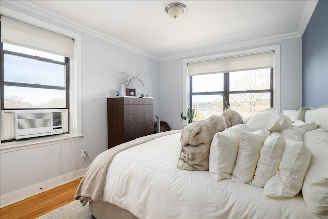 710 Riverside Dr Unit 6B, New York Manhattan, NY 10031 - bedroom featuring cooling unit, ornamental molding, wood finished floors, and baseboards