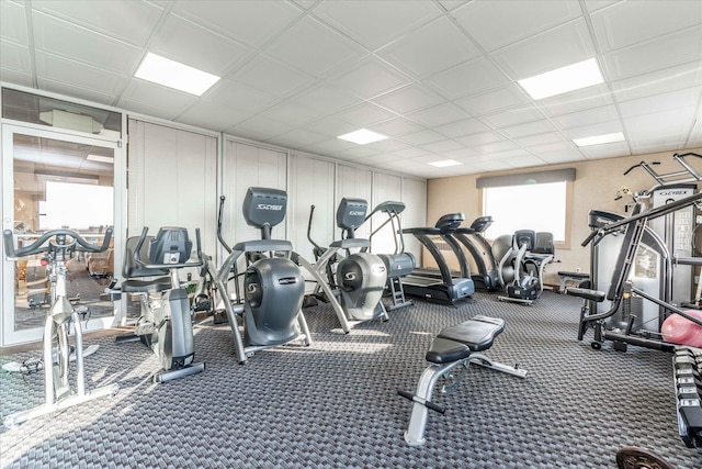 exercise room with a drop ceiling