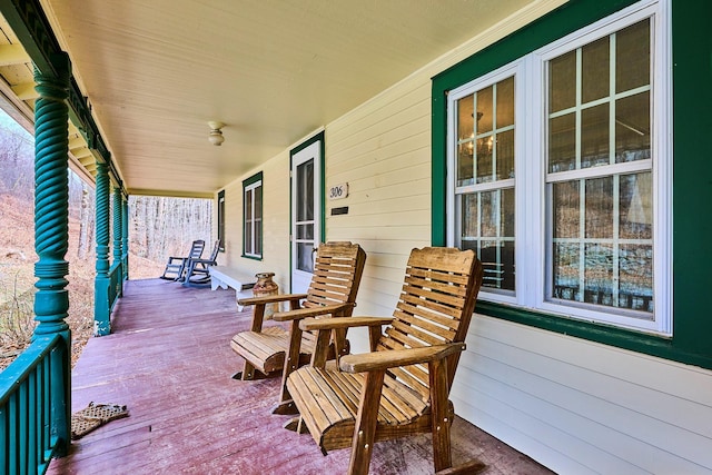 wooden terrace with a porch