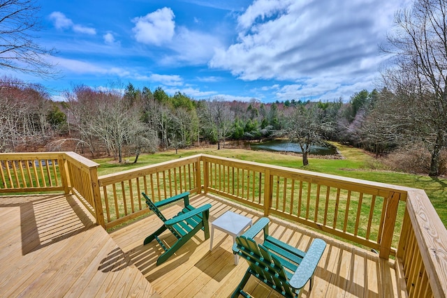 deck featuring a water view and a yard