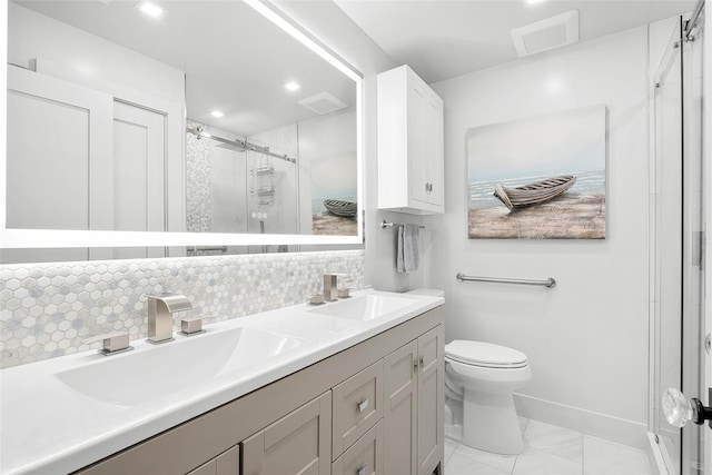 bathroom with a sink, backsplash, a shower stall, and visible vents