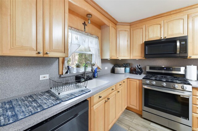 91 Meyerhoff Rd, Hurleyville, NY 12747 - kitchen with light countertops, gas stove, light brown cabinets, and dishwasher
