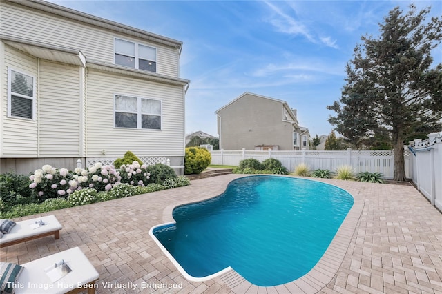 1312 Cayuga Ave, North Bellmore, NY 11710 - view of swimming pool featuring a fenced backyard, a fenced in pool, and a patio