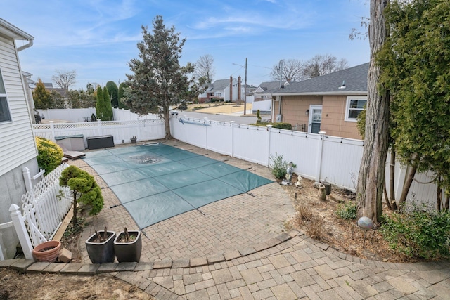 1312 Cayuga Ave, North Bellmore, NY 11710 - view of swimming pool with a patio area, a fenced backyard, and a fenced in pool