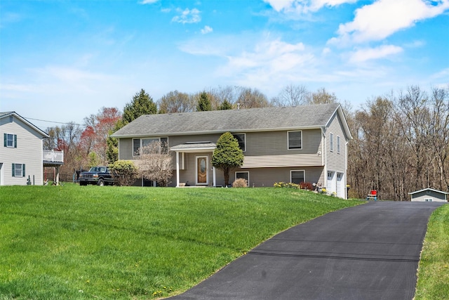 raised ranch with a front lawn
