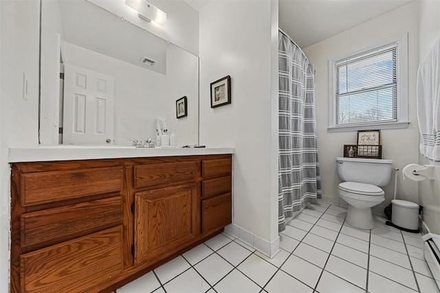 bathroom with baseboards, tile patterned flooring, vanity, and toilet