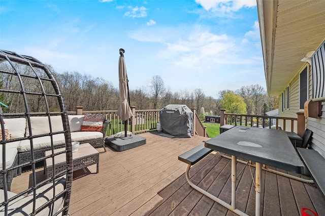deck featuring outdoor dining space and an outdoor hangout area