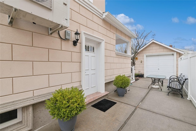 87-15 258th St, Floral Park, NY 11001 - doorway to property with fence, outdoor dining space, and a patio