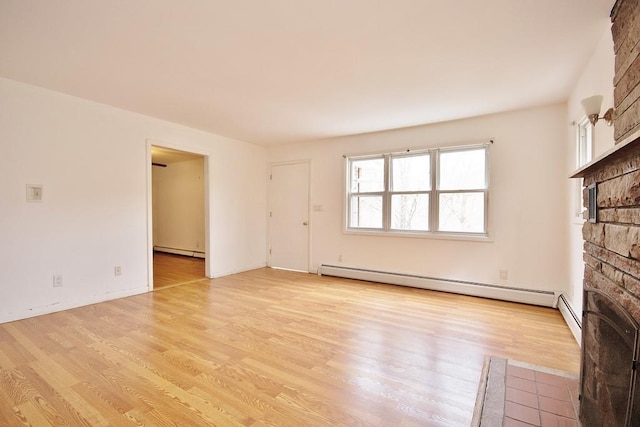 9 Old Albany Post Rd N, Cold Spring, NY 10516 - unfurnished living room with a baseboard heating unit, a fireplace with flush hearth, and light wood-style floors