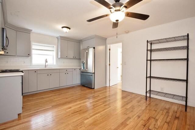 9 Old Albany Post Rd N, Cold Spring, NY 10516 - kitchen with light wood finished floors, light countertops, backsplash, and appliances with stainless steel finishes