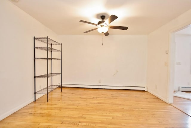 9 Old Albany Post Rd N, Cold Spring, NY 10516 - spare room featuring a baseboard heating unit, baseboards, a ceiling fan, and light wood-style flooring