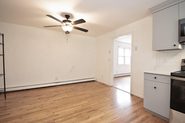 9 Old Albany Post Rd N, Cold Spring, NY 10516 - kitchen featuring gray cabinets, a baseboard heating unit, stainless steel electric stove, light wood-style flooring, and ceiling fan