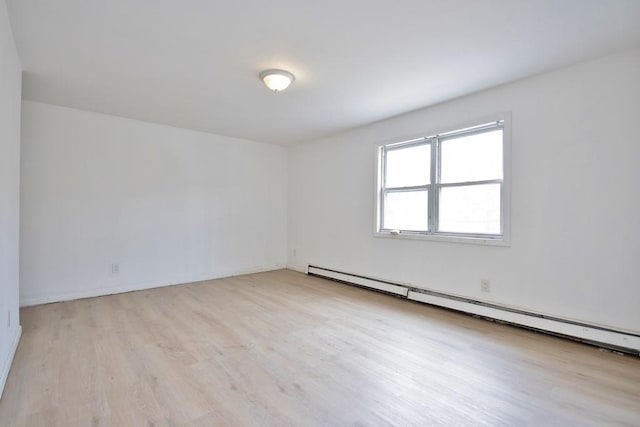 9 Old Albany Post Rd N, Cold Spring, NY 10516 - empty room featuring a baseboard radiator and light wood-style flooring