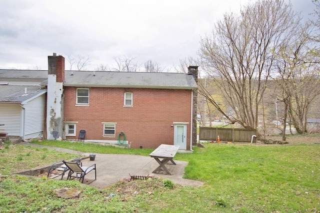9 Old Albany Post Rd N, Cold Spring, NY 10516 - rear view of property featuring brick siding, a patio area, and a chimney