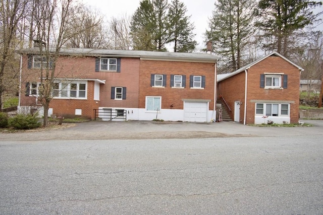 9 Old Albany Post Rd N, Cold Spring, NY 10516 - exterior space featuring a garage, stairs, and aphalt driveway