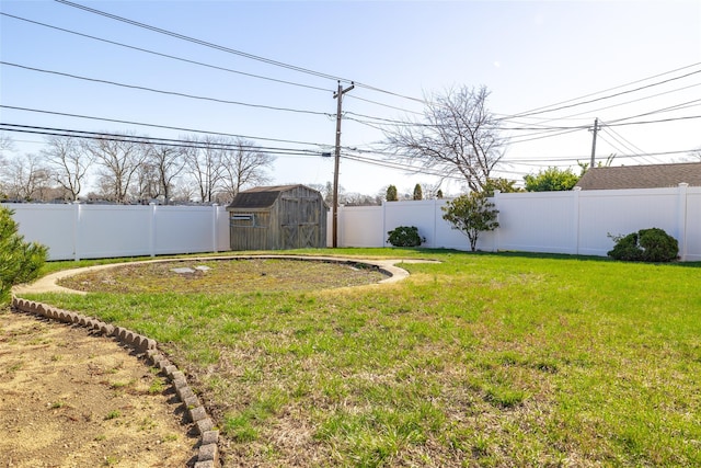 view of yard with a fenced backyard, a storage shed, and an outdoor structure