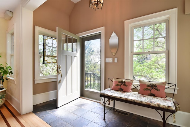 entryway featuring baseboards and visible vents