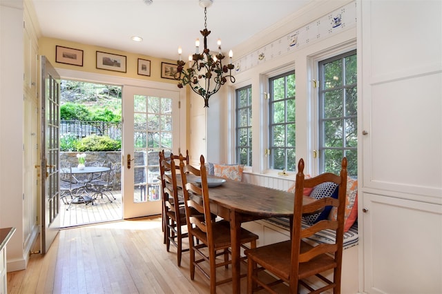 dining space with a notable chandelier and light wood-style floors