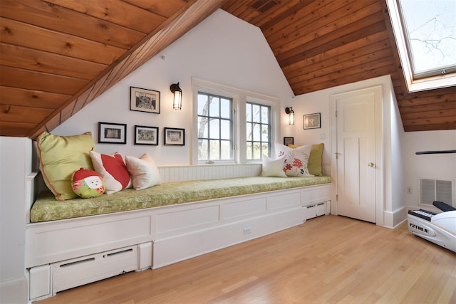 bedroom featuring wood ceiling, vaulted ceiling, and visible vents