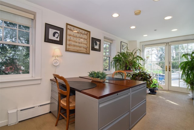 office space with recessed lighting, light colored carpet, and baseboard heating