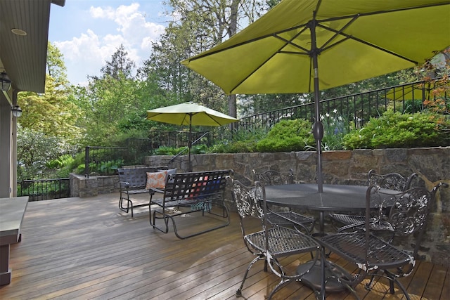 deck featuring outdoor dining area