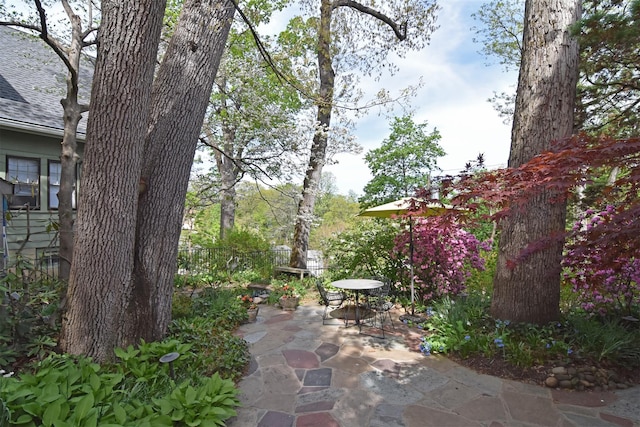 view of patio with fence and outdoor dining space