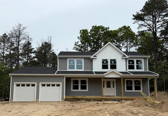 111 Currans Rd, Middle Island, NY 11953 - view of front of house with an attached garage, dirt driveway, and covered porch
