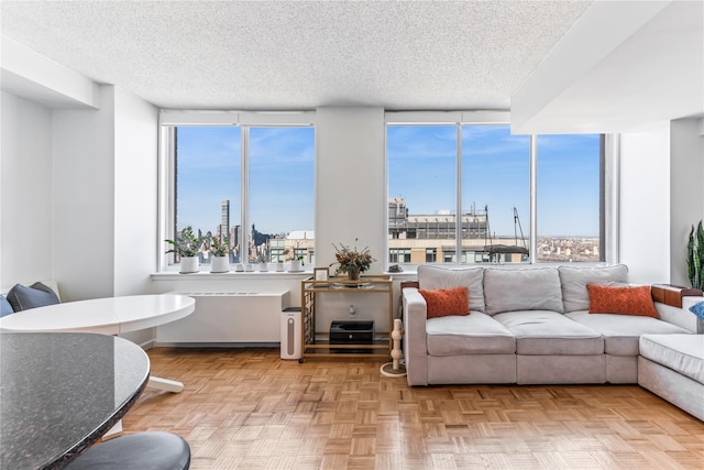 4-74 48th Ave Unit Ph4D, Long Island City, NY 11109 - living room with a textured ceiling, plenty of natural light, and a wall of windows