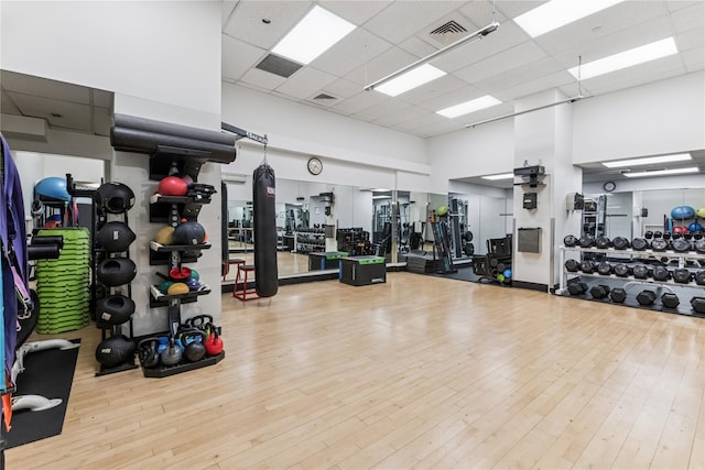 4-74 48th Ave Unit Ph4D, Long Island City, NY 11109 - workout area featuring a towering ceiling, wood finished floors, and a paneled ceiling