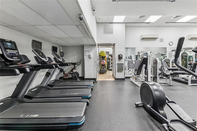 4-74 48th Ave Unit Ph4D, Long Island City, NY 11109 - exercise room with a paneled ceiling and a wall unit AC